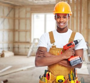 construction worker using a range of tools in his job