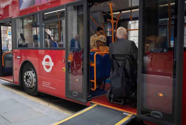 a person in a wheel chair boards a bus