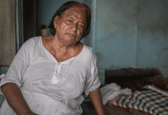 a sad lady all alone in a dirty room